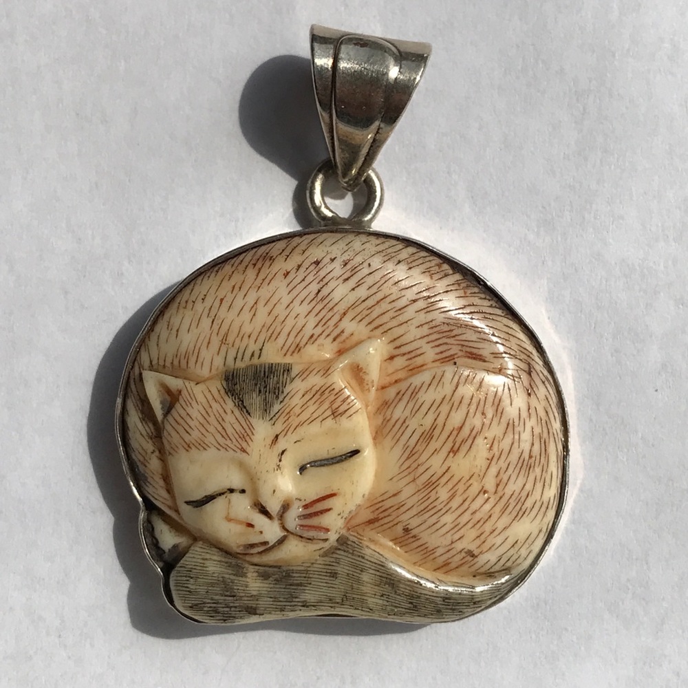 Carved Bone Cuddly Cat in Silver Pendant